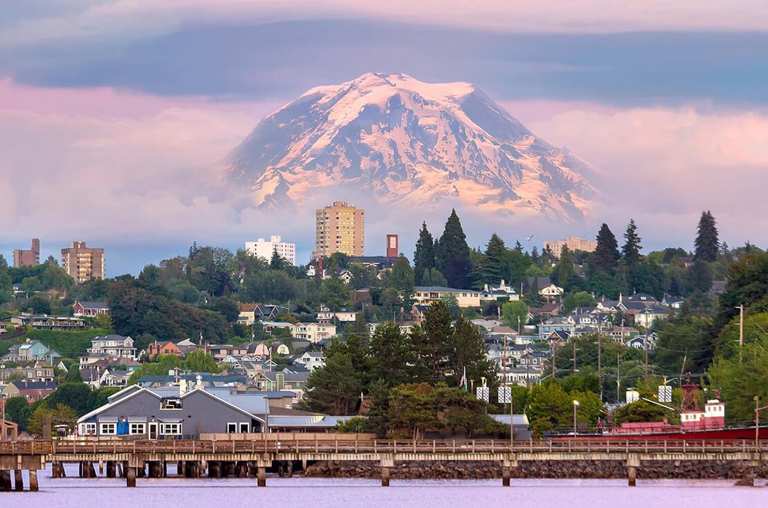 Mount Rainier over Tacoma WA waterfront during alpenglow sunset evening